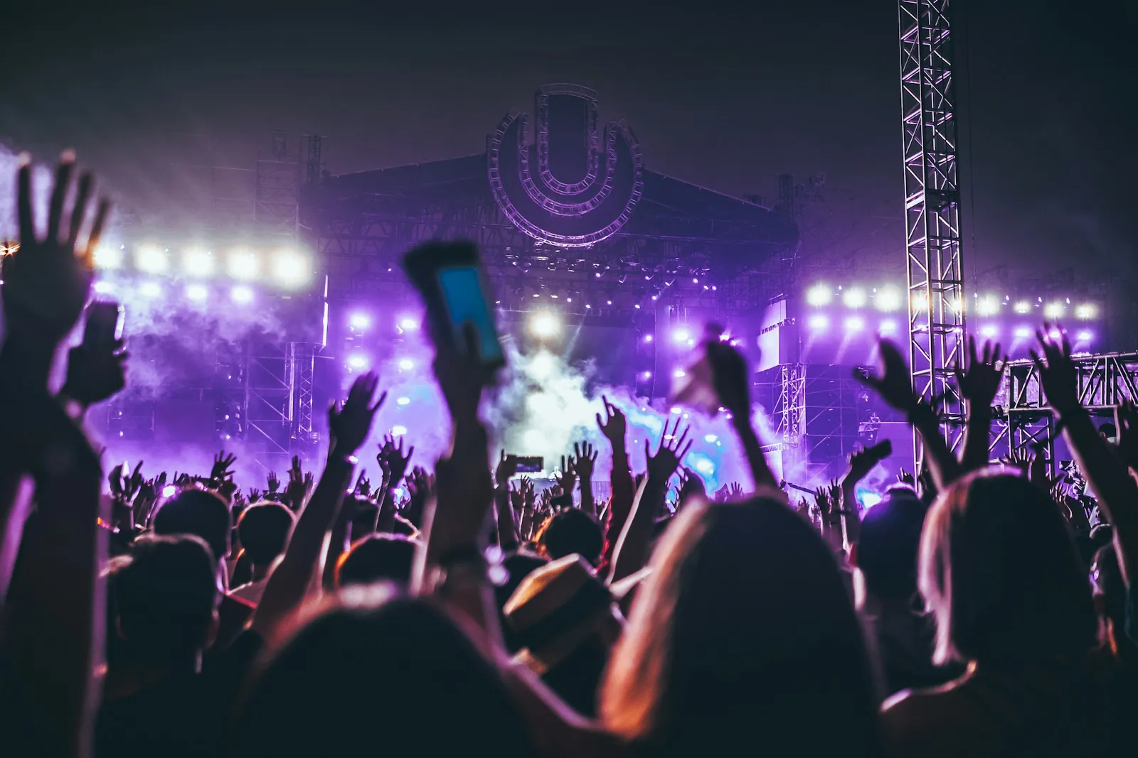Concert crowd with raised hands