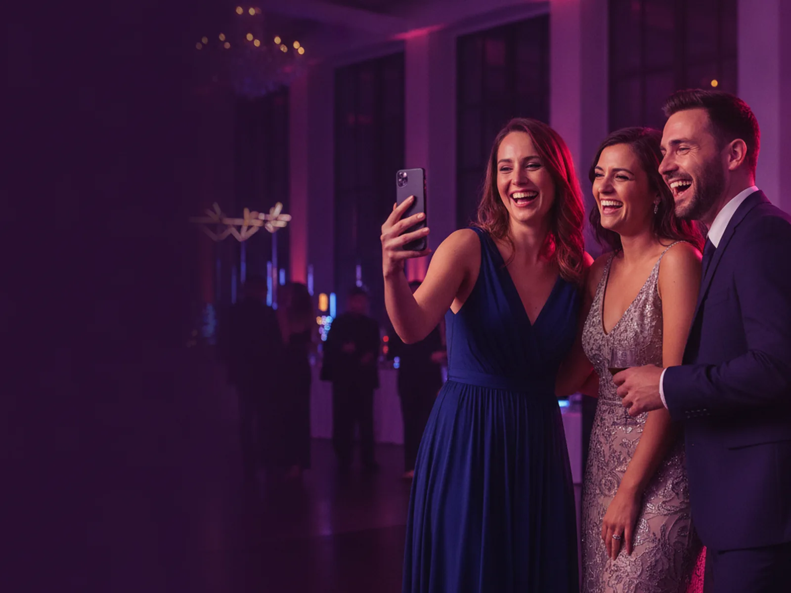 AI Photo Booth: The Complete Guide for Professional Operators 2 Three event guests laughing at an AI photo booth portrait on a phone